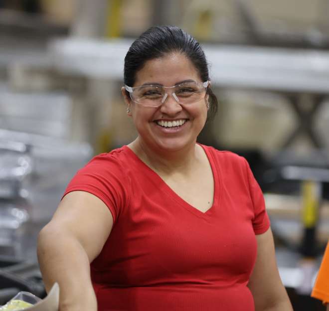 Production team member at shelving manufacturer