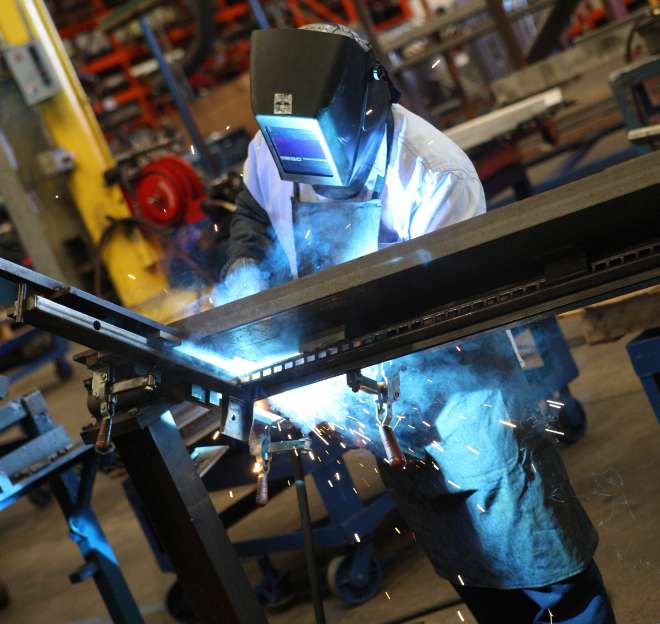 Welder fabricating custom retail fixtures
