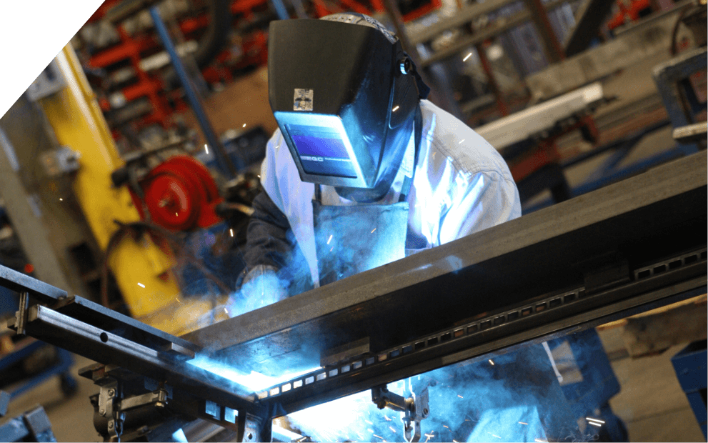 Welder fabricating custom retail fixtures